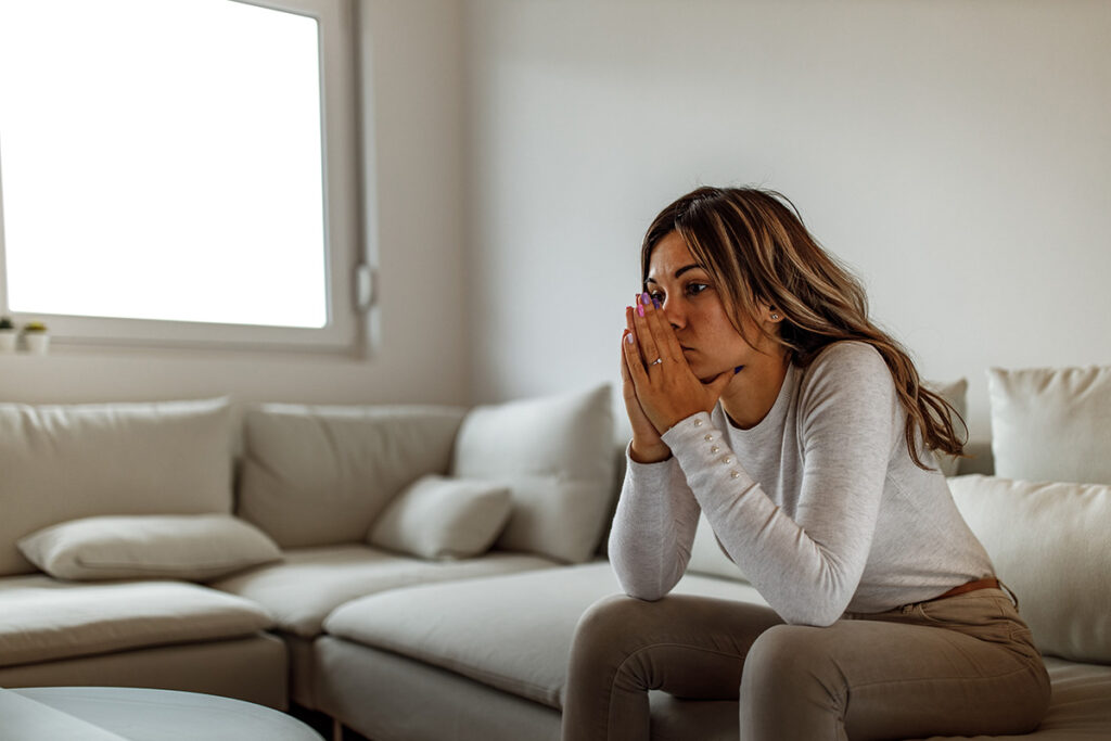 A woman debating the idea of loneliness and alcohol abuse