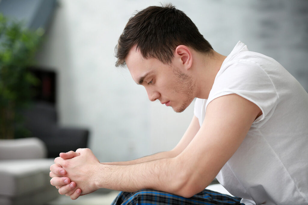 A young man thinking about residential treatment